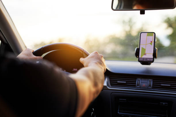 istock A man drives a car at sunset 996990930