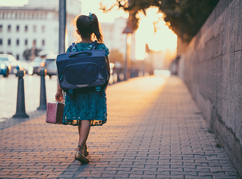 Little girl going to school