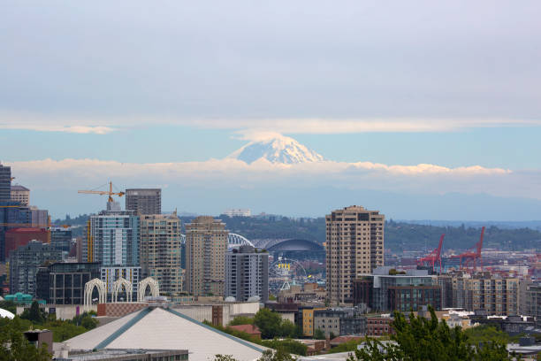 istock Seattle WA downtown city skyline with Mt. Rainier partially covered in clouds 996995268