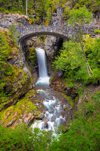 Christine Falls under stone bridge over Van Trump Creek along scenic drive in Mount Rainier National Park Washington State