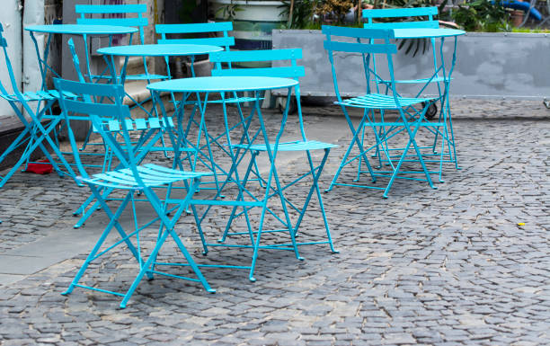 istock Restaurant terrace with metal tables and chair 997002914