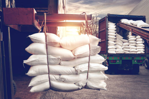 forklift handling white sugar bags stuffing into a container truck - warehouse forklift distribution warehouse merchandise imagens e fotografias de stock