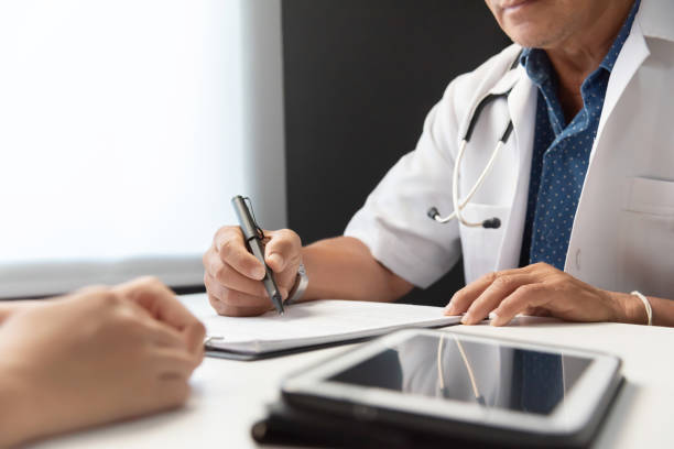 istock Doctor talking with Female patient. 997014420