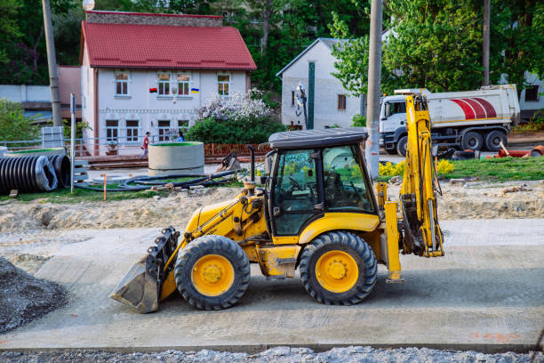 istock construction site. heavy machines making street road on sunset 997022344