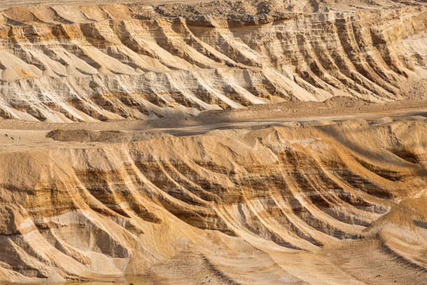 istock Background of digged soil in brown coal open pit mine 997029056