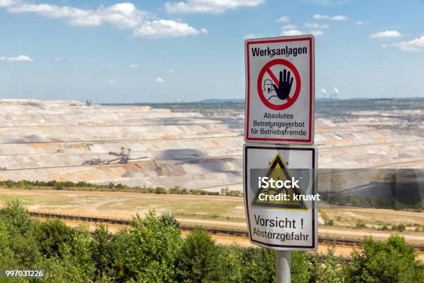 Warning Sign Near Open Pit Mine Hambach In Germany Stock Photo - Download Image Now - Aerial View, Agricultural Field, Alertness
