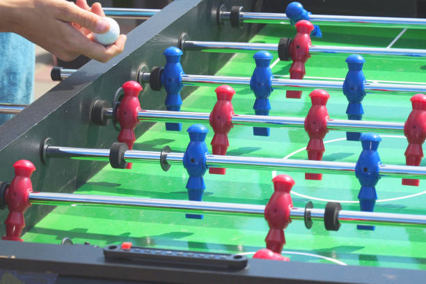 istock People play kicker table football soccer 997031362