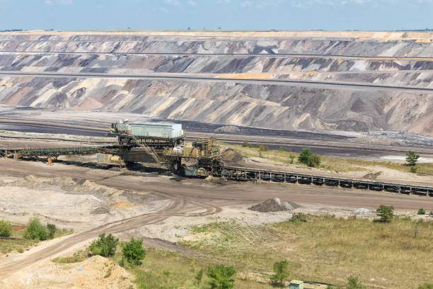 istock Brown coal open pit landscape with conveyer belt in Germany 997031946