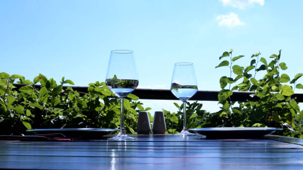 istock water glasses on wooden table 997042112