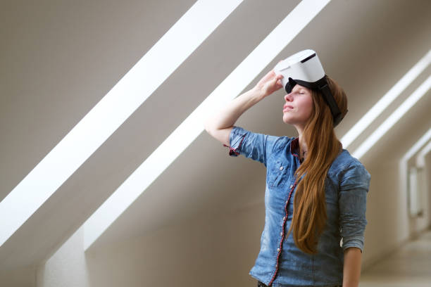 istock redhead girl with virtual reality glasses 997043050
