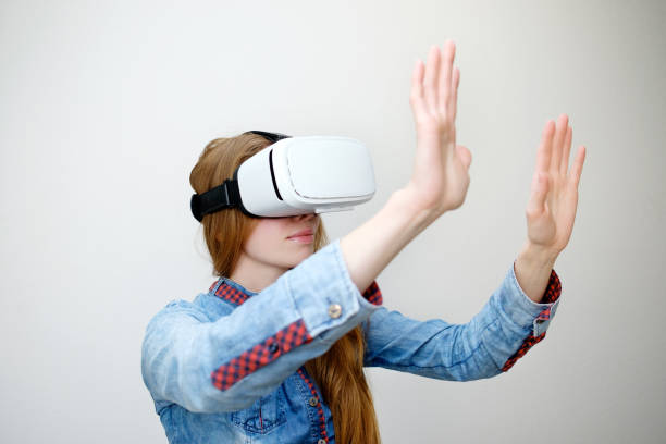 istock redhead girl with virtual reality glasses 997043056