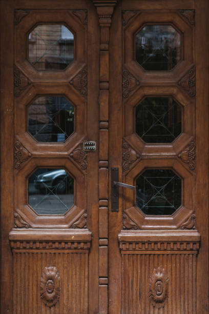 istock old vintage wooden doors close up with lock 997043178