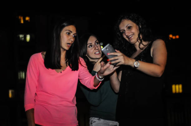 istock Girls make self on the roof 997049548