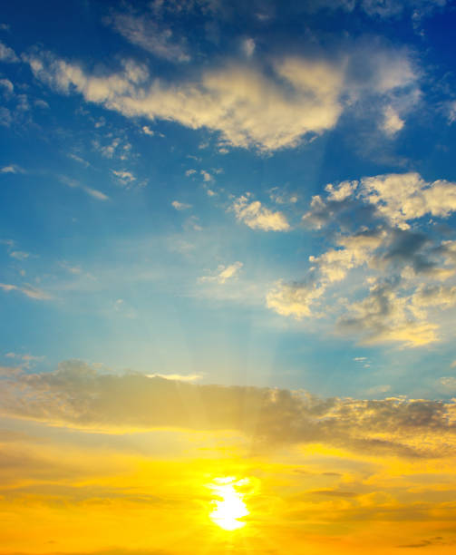 istock Cloudy sky and bright sunrise over the horizon 997049758