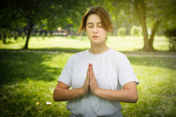 istock Woman doing yoga 997071104