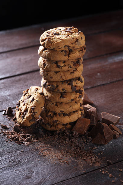 istock Chocolate cookies on table. Chocolate chip cookies shot with chocolate 997074394