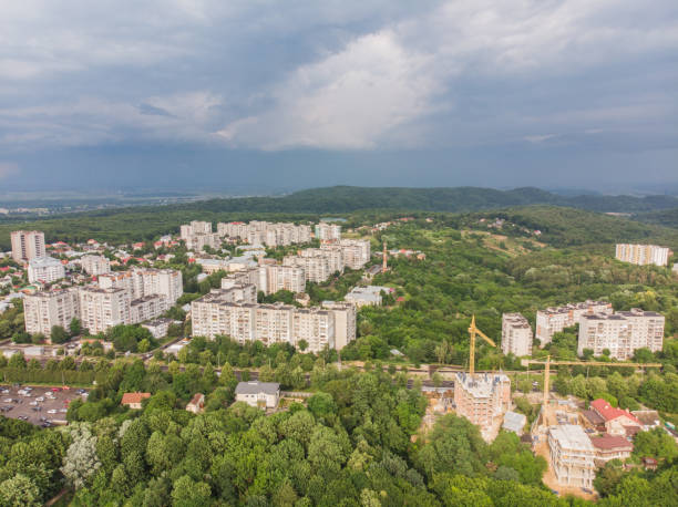 istock overcast weather. rain is coming above city 997076098