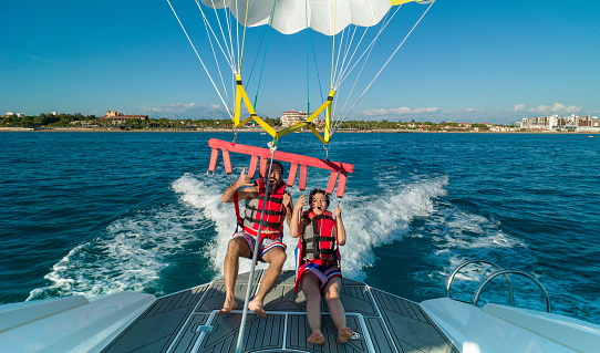 Lovely couple during parasailing