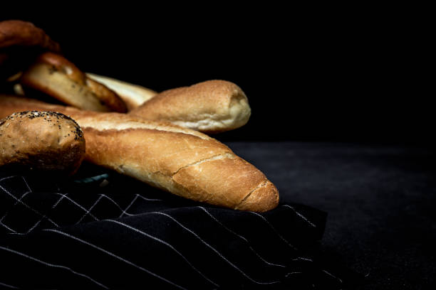 istock Assortment of fresh and golden breads. 997095846