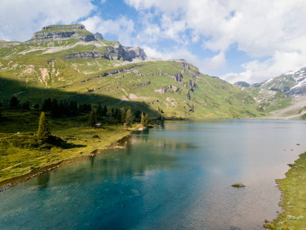 istock Drone flight over a mountain lake in Switzerland 997097550
