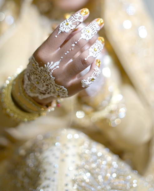 istock Woman Bride Hands with Henna, Indonesian Wedding Tradition Ceremony. 997105672