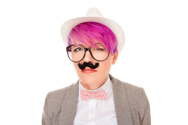 Beautiful, pretty young woman imitating upset suspicious frustrated man. Attractive girl with fake mustache under nose imitating moustache posing on white background Negative emotion face expression.