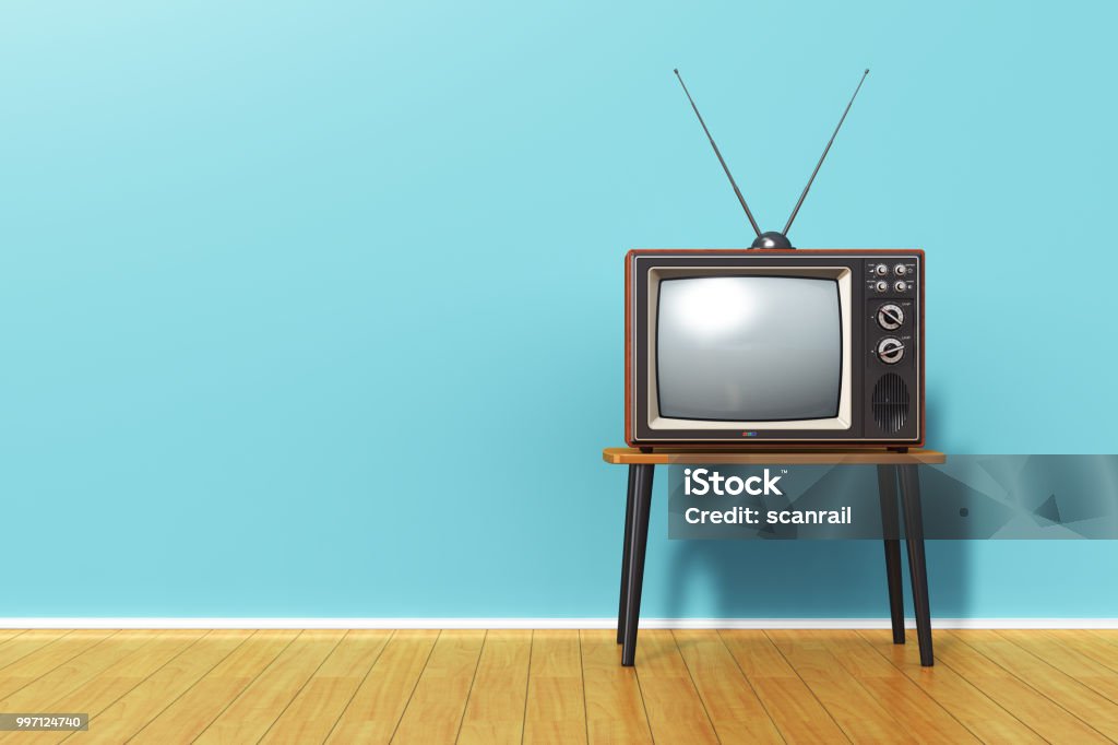 Old retro TV against blue vintage wall in the room Creative abstract 3D render illustration of the old retro TV television set with antenna on table against blue vintage wall background and wooden plank floor in the room Television Set Stock Photo