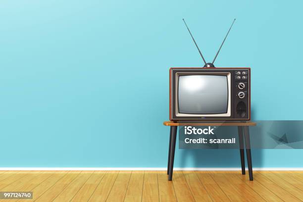 Old Retro Tv Against Blue Vintage Wall In The Room Stock Photo - Download Image Now - Television Set, Television Industry, Retro Style