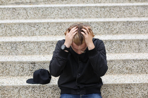 istock Teenager depressed sitting 997140042