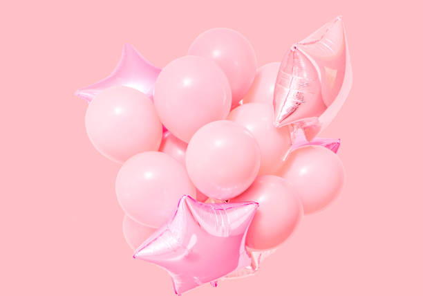 istock Pink birthday air balloons pink background mockup 997150362