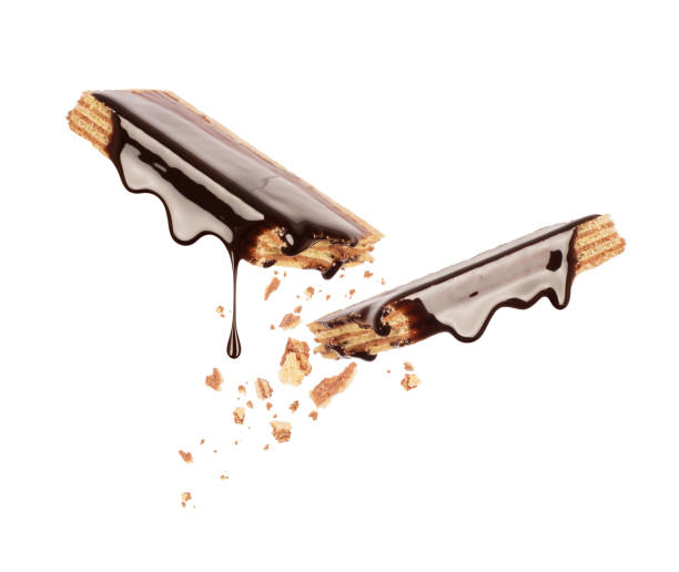 istock Waffles broken into two halves and poured with chocolate isolated on a white background 997150472