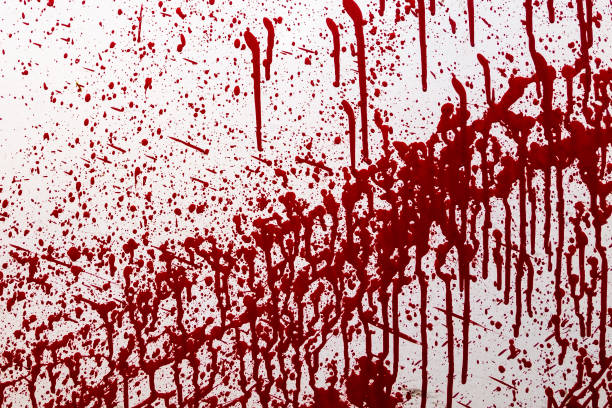 istock stained red paint, similar to the blood on a white background. 997189348