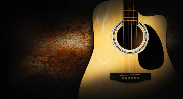 istock Part of acoustic guitar on old rusty background 997212618