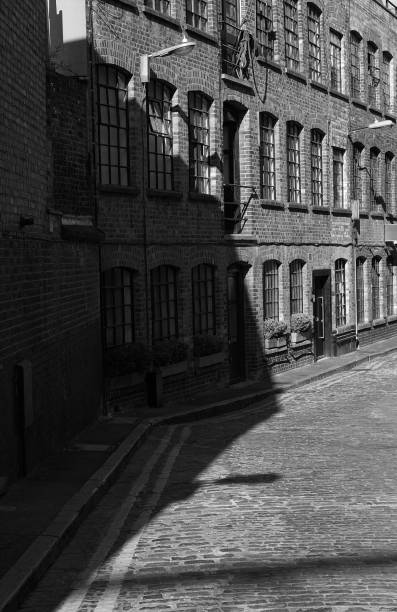 istock Brick Wall Warehouses and street paved with setts. 997245266