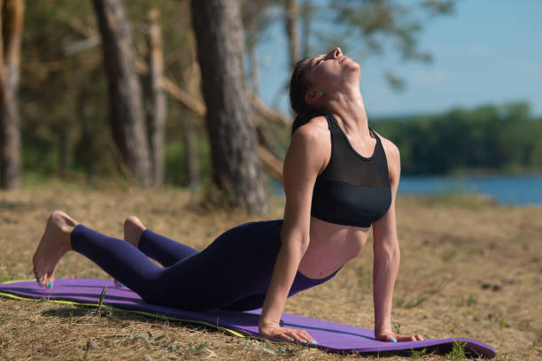 istock Young woman doing yoga 997264634