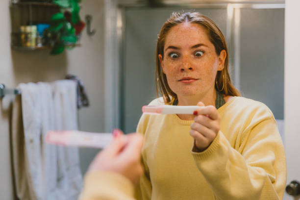 istock Surprised Girl After Looking At Pregnancy Test 997275262