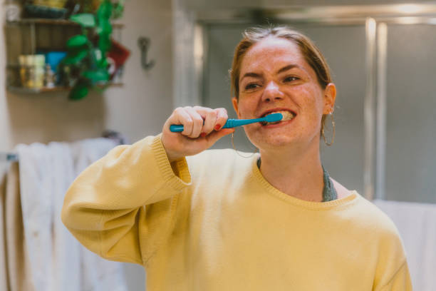 istock Fierce Young Woman Brushing Teeth 997275298