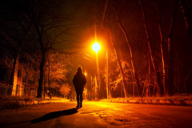 istock lonely woman in the night 997275800