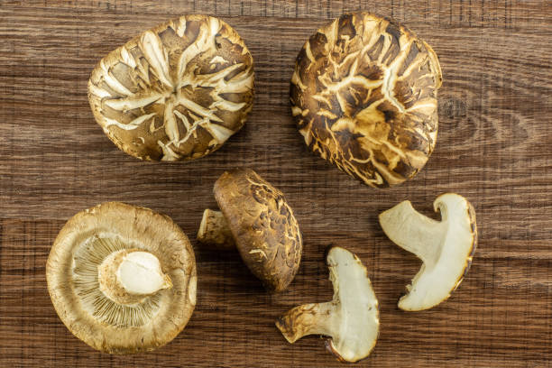 istock Fresh raw shitake mushroom on brown wood 997296438
