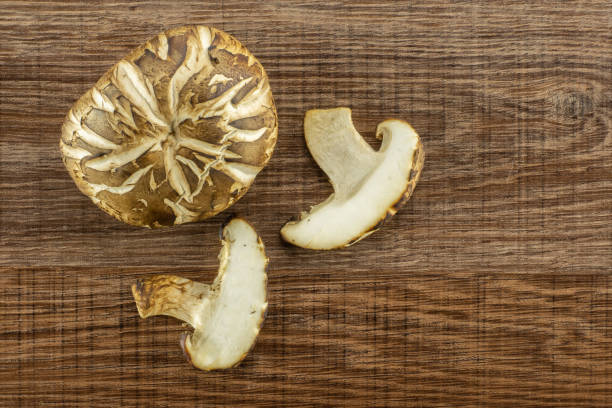 istock Fresh raw shitake mushroom on brown wood 997296602