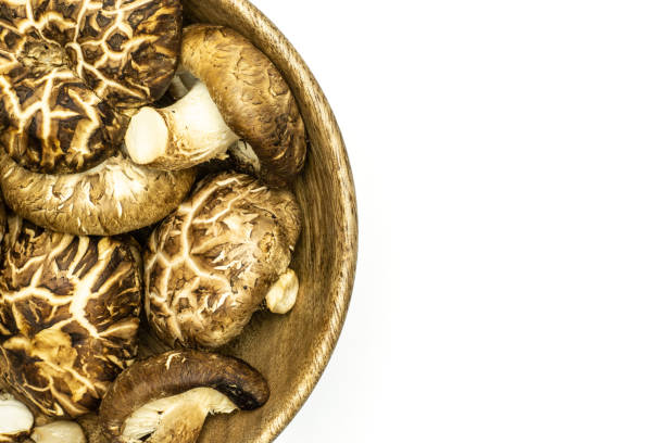 istock Fresh raw shitake mushroom isolated on white 997298908