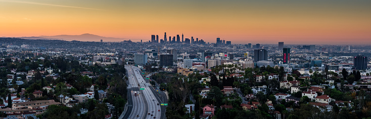 Aerial panorama of the City of Los Angeles at dusk, taken from up in the Hollywood Hills and looking towards the downtown skyline.
