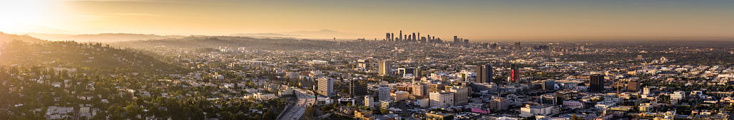 Aerial panorama of the City of Los Angeles at dusk, taken from up in the Hollywood Hills and looking towards the downtown skyline.