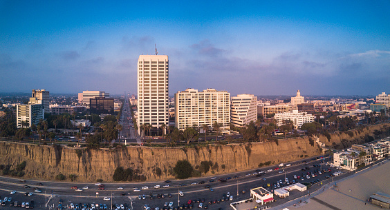 Aerial panorama of the seafront in northern Santa Monica, with the beach, parking lots, PCH and Ocean Avenue, with a view up Wilshire Boulevard.