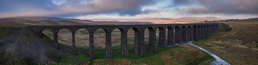 Aerial panorama of the Ribblehead Viaduct, the 24-arched bridge that carries the Settle-Carlisle Railway across Batty Moss in north Yorkshire, England