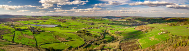 Yorkshire Countryside in Sunlight - Aerial Panorama Aerial panorama of the Worth Valley in West Yorkshire, a narrow valley connecting the villages of Oxenhope, Haworth and Oakworth, famous as the home of the Bronte sisters. west yorkshire stock pictures, royalty-free photos & images