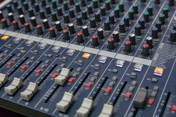 istock Closeup of the professional audio mixing console. Selective focus. 997320144