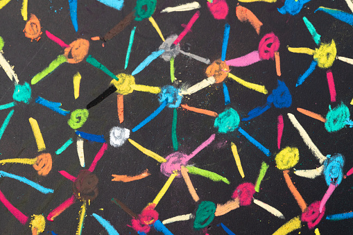 Decentralize, bond or social network concept, macro view of colorful pastel link and connect chalk line between multiple dot or peers on blackboard.