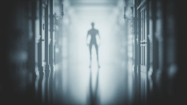 istock Mysterious man at the end of the hall 997329418