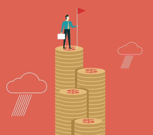 istock Businessman holding flag on top of money 997333652